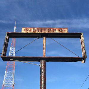 Signs of Emptiness: Rusted SOE with Antenna and Enter Sign